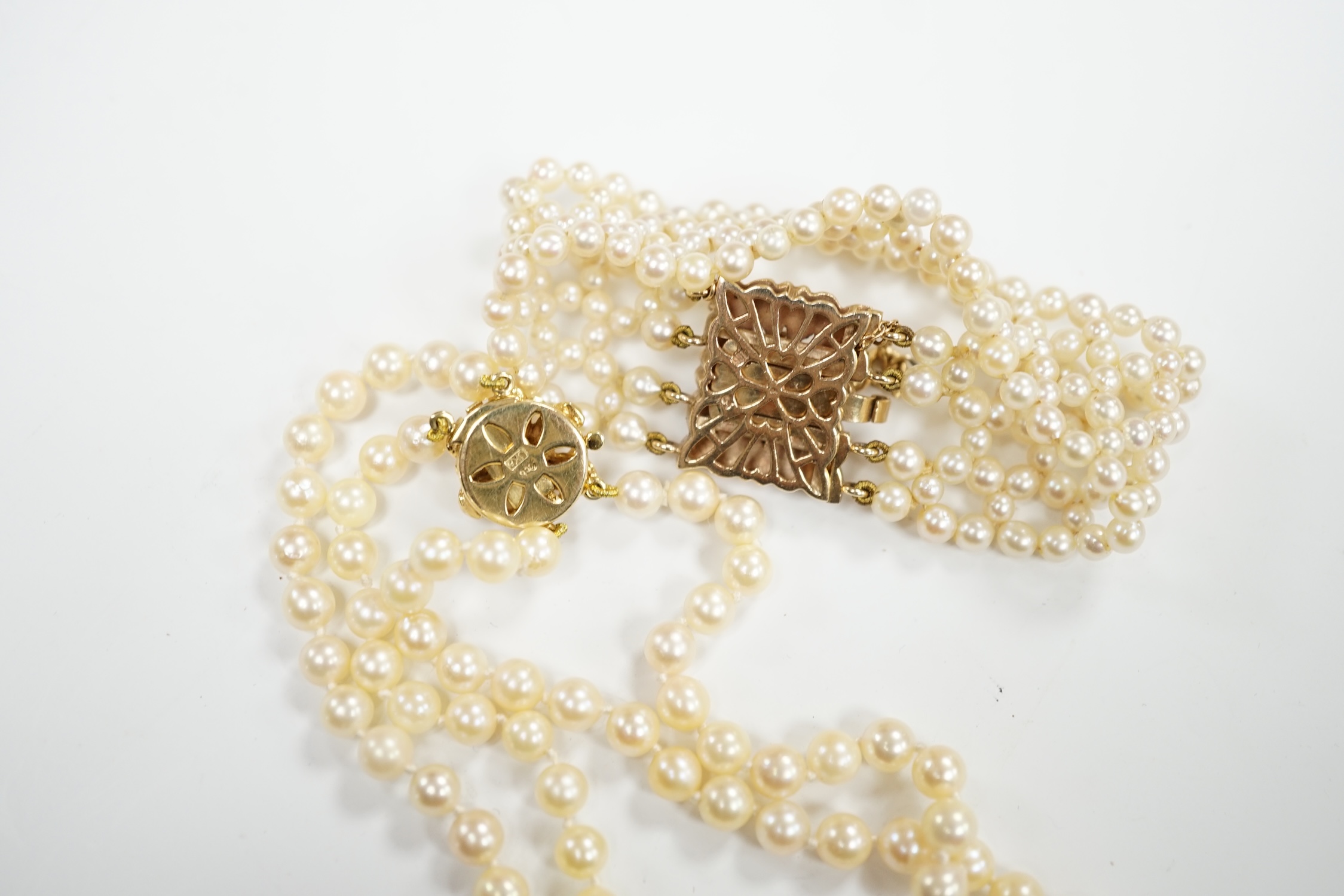 A cultured pearl cluster set bracelet, with seed pearl cluster set 9ct clasp, 16cm, and a similar double row choker necklace, with 9ct clasp, 38cm.